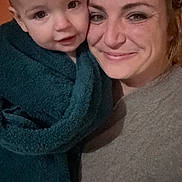 Lahna joined the competition — help win amazing prizes! adult, baby, blanket, clothing, face, female, happy, head, hoodie, knitwear, laughing, newborn, person, photography, portrait, selfie, smile, sweater, sweatshirt, woman