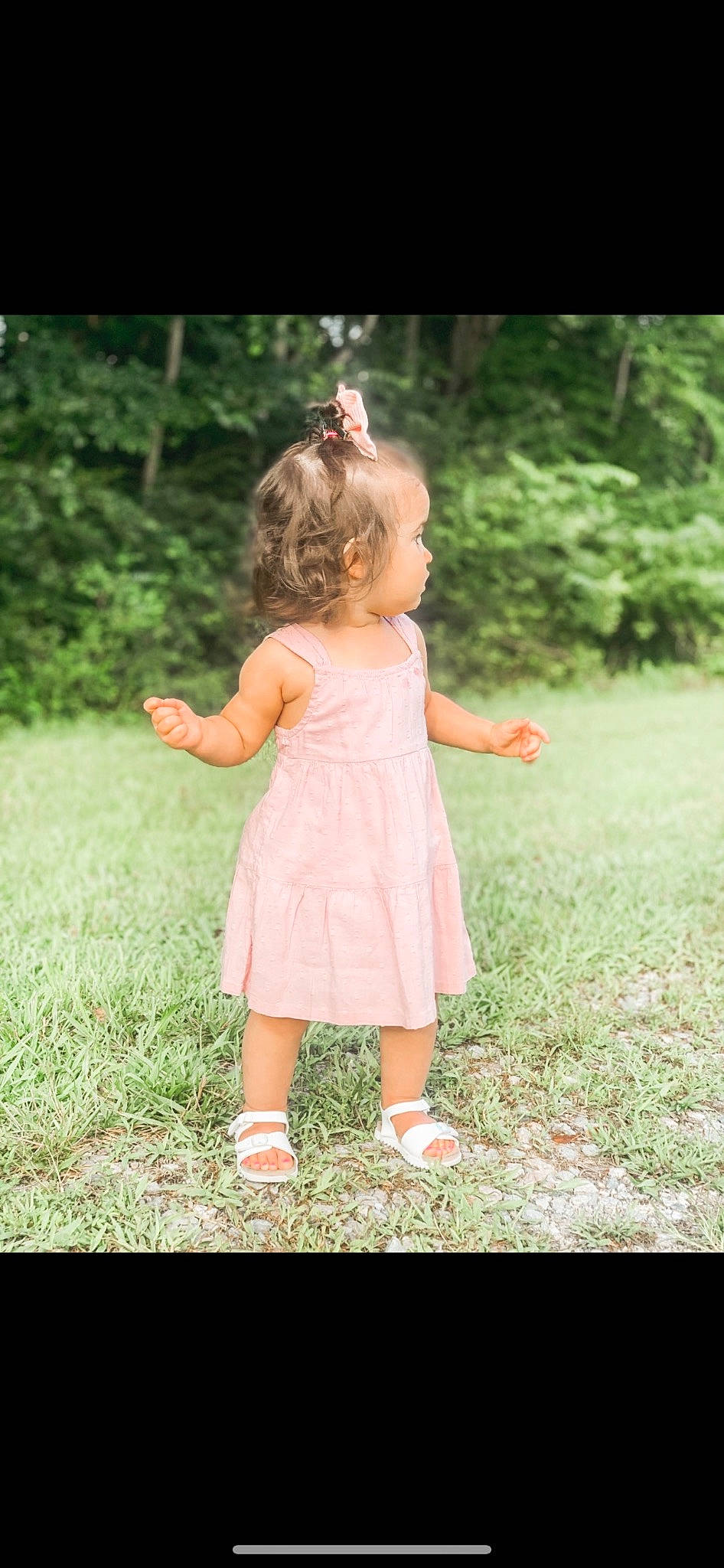 Eleanor is registered to the contest to win money with this photo: baby, baby_toddler_clothing, day_dress, dress, flash_photography, forest, gesture, grass, grass_family, grassland, green, hair, happy, meadow, one_piece_garment, people_in_nature, person, pink, plant, toddler