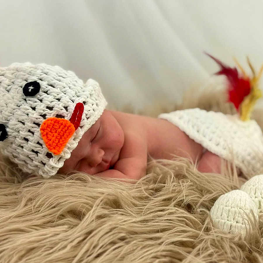 Clara joined the competition — help win amazing prizes! newborn, baby, sleeping, infant, portrait, crocheted_hat, chicken_costume, orange_beak, red_comb, white_feathers, fluffy_blanket, furry_blanket, baby_photography, studio, closeup, peaceful, animal_costume, lying_down, soft_lighting, cute