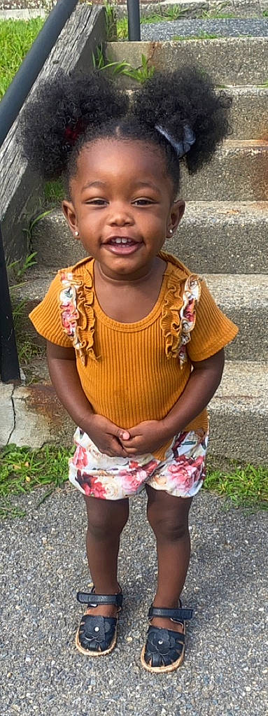 Alaiya is registered to the contest to win money with this photo: adaptation, black, cheek, clothing, face, forehead, happy, head, lip, mouth, nose, organ, people, person, pink, plant, shorts, skin, sleeve, summer