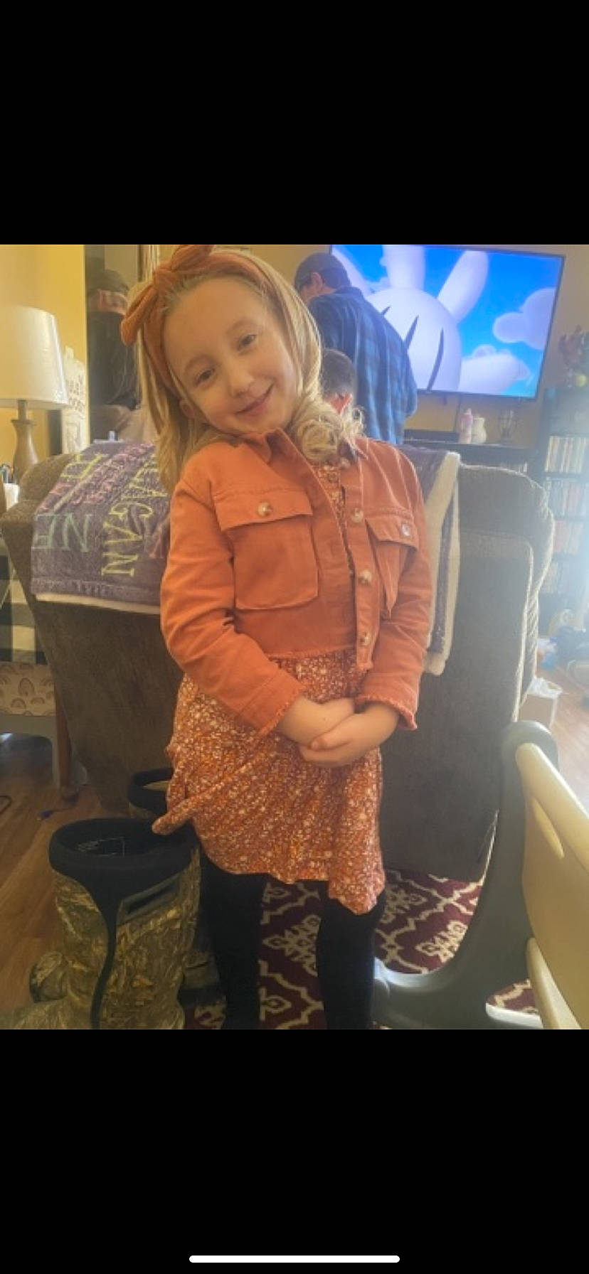 Gracelyn joined the competition — help win amazing prizes! blond, brown_hair, chair, comfort, event, face, flooring, fun, happy, human_leg, joy, lamp, lap, long_hair, person, room, sitting, smile, standing, thigh