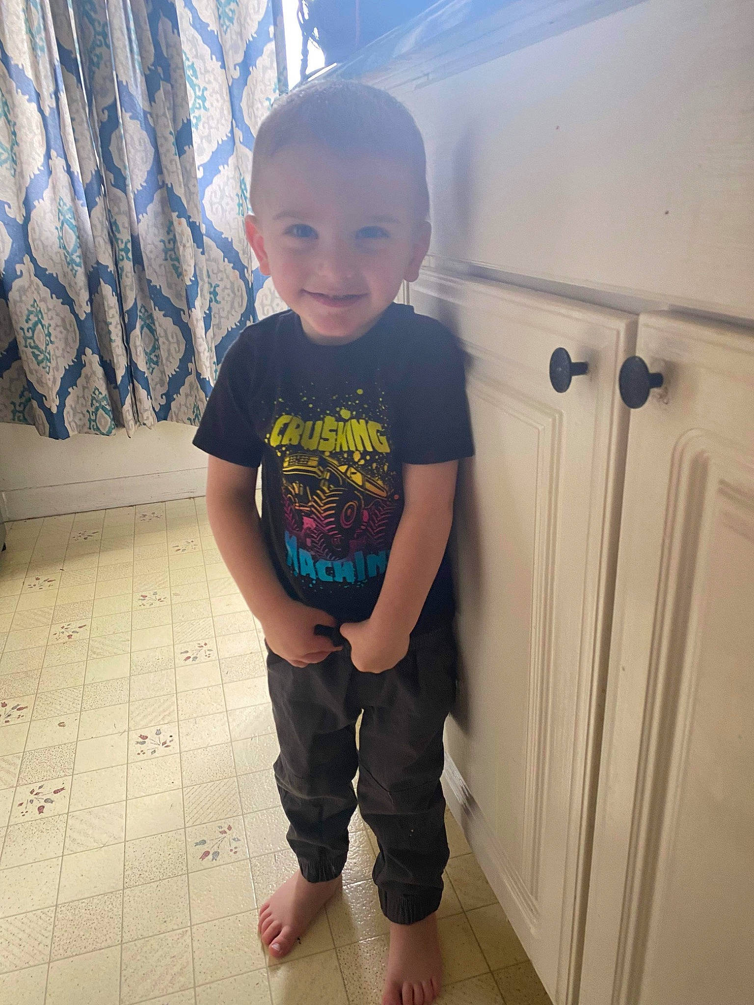Gregory joined the competition — help win amazing prizes! baby_toddler_clothing, chin, floor, flooring, happy, hardwood, joint, joy, knee, leg, person, shoulder, sleeve, smile, standing, t_shirt, thigh, tints_and_shades, toddler, trunk