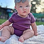 Desiree is registered to the contest to win money with this photo: baby, child, infant, headband, bow, purple_clothing, outdoor, blanket, sitting, cute, face, portrait, skin, legs, feet, nature, soft_light, closeup, curious, young