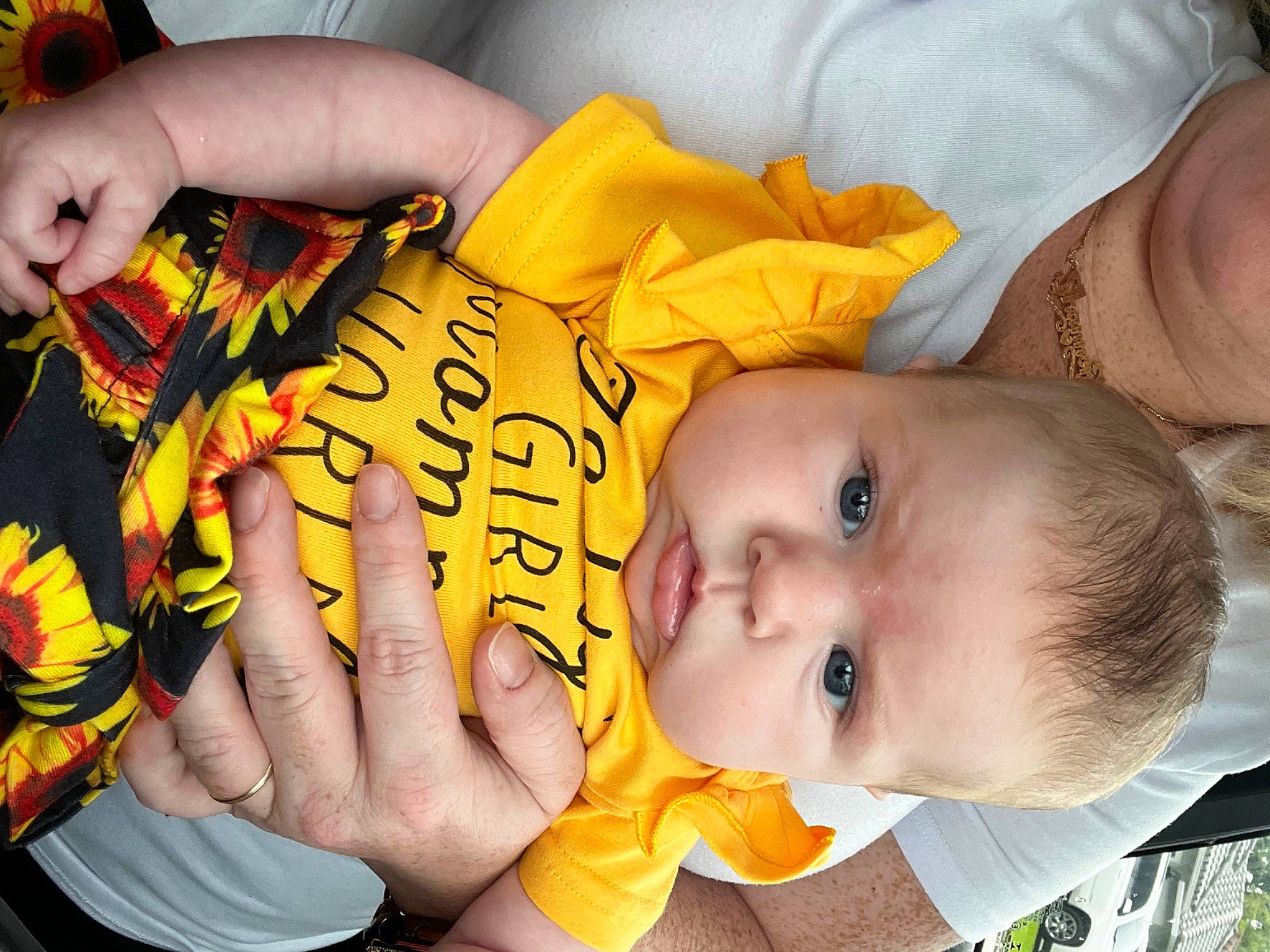 Caroline joined the competition — help win amazing prizes! baby, baby_toddler_clothing, chair, cheek, child, finger, fun, hand, happy, mouth, nail, nose, orange, person, plant, room, skin, thumb, toddler, wrist