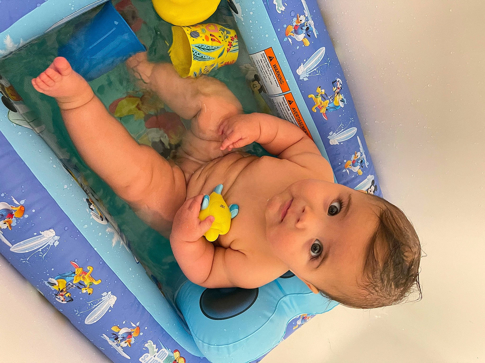 Phoebe is registered to the contest to win money with this photo: art, baby, baby_playing_with_toys, baby_products, baby_toys, bathing, child, foot, fun, happy, leisure, nail, person, plastic, play, product, room, toddler, toy, water