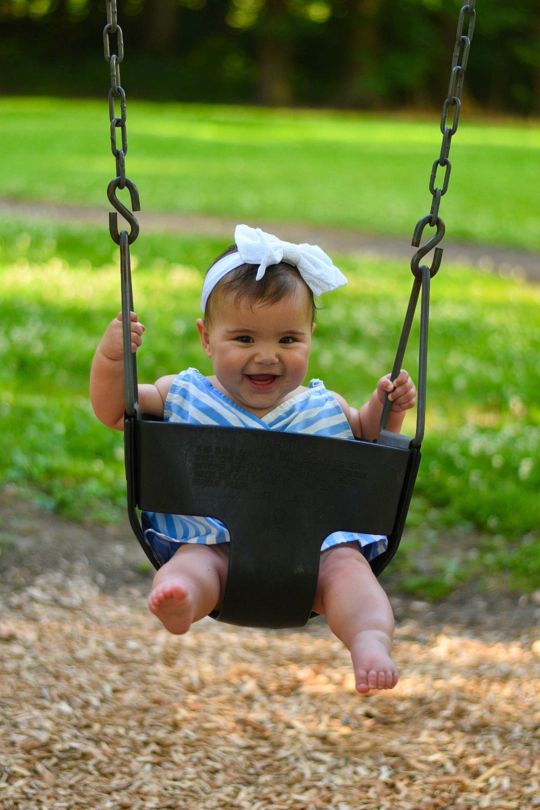 Phoebe joined the competition — help win amazing prizes! arm, black, botany, eye, face, facial_expression, grass, hand, happy, head, joy, mammal, natural_environment, nature, people_in_nature, person, photograph, plant, playground, smile