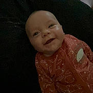 Serenity joined the competition — help win amazing prizes! baby, casual, child, cozy, cushion, cute, dark, face, happy, indoors, infant, onesie, patterned_clothing, person, portrait, resting, smile, soft, warm, young