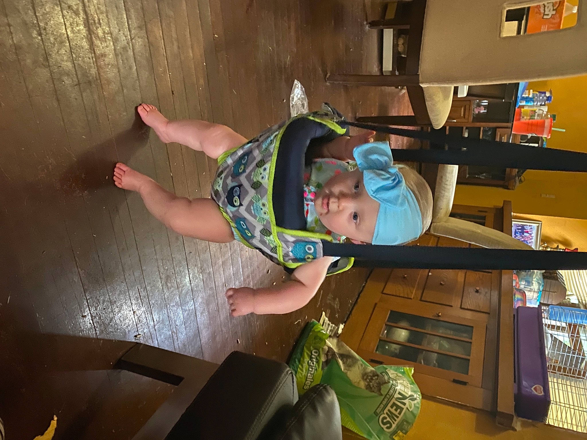 Annmarie is registered to the contest to win money with this photo: baby, baby_toddler_clothing, ceiling, child, fun, hardwood, hat, headwear, person, play, room, shelf, shelving, t_shirt, toddler, wood