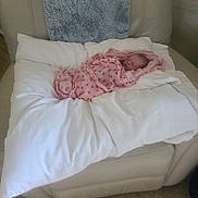 Brooklynn is registered to the contest to win money with this photo: newborn, baby, infant, sleeping, blanket, pink, onesie, armchair, pillow, cushion, cozy, indoors, portrait, face, head, bedding, furniture, home, resting, photograph