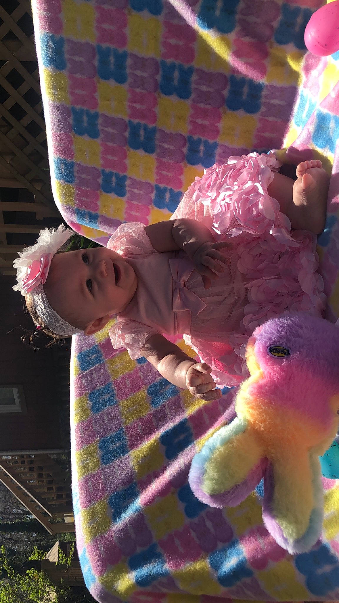 Ellianna is registered to the contest to win money with this photo: baby, baby_toddler_clothing, blue, child, design, fun, happy, headwear, light, linens, magenta, pattern, person, pink, plaid, purple, smile, tartan, textile, toddler