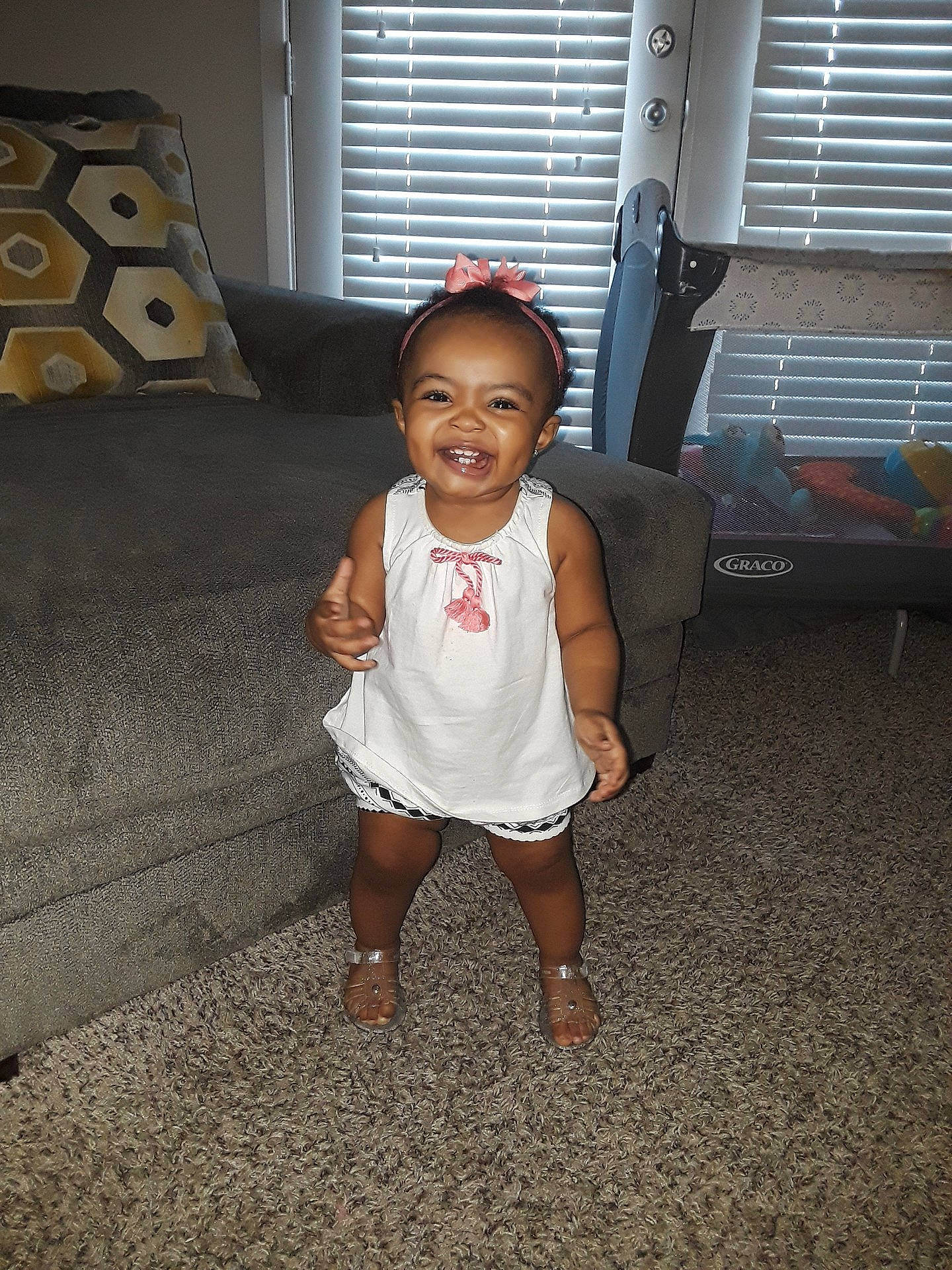 Janiyah joined the competition — help win amazing prizes! abdomen, child, cool, day, facial_expression, flooring, fun, girl, joy, leg, person, product, sitting, skin, smile, snapshot, standing, textile, toddler, trunk