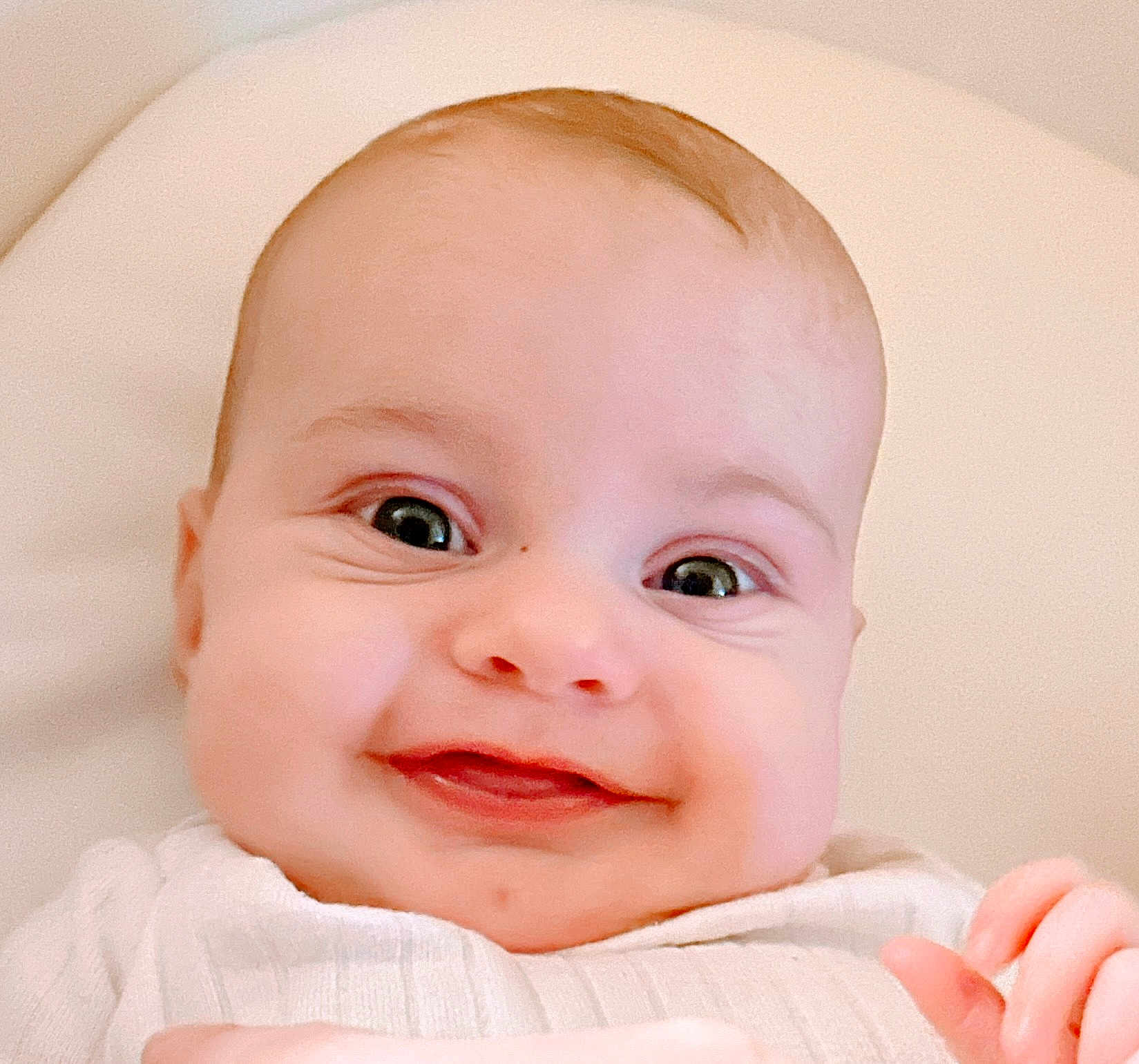 Madilynn is registered to the contest to win money with this photo: baby, smiling, face, closeup, child, infant, cute, happy, portrait, skin, eyes, cheeks, clothing, hand, newborn, person, expression, indoors, soft_light, young