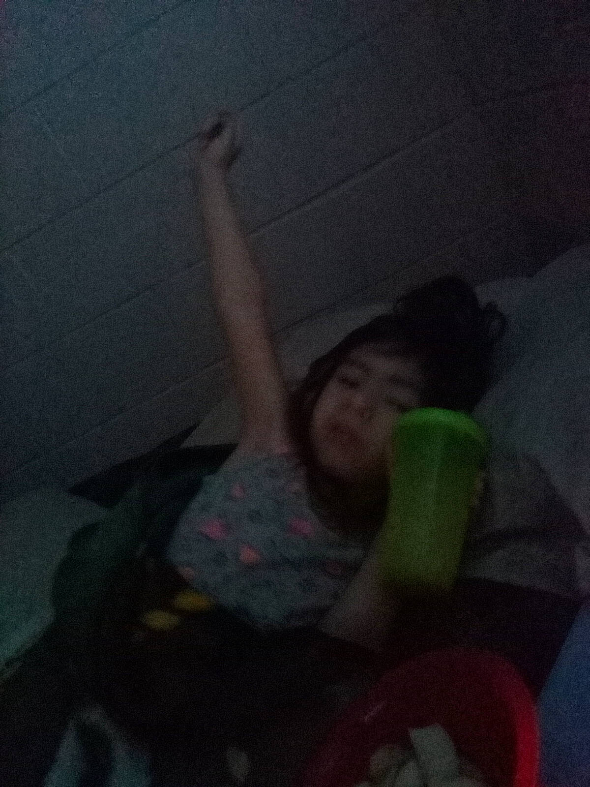 Jazmin is registered to the contest to win money with this photo: ceiling, child, cloud, comfort, darkness, elbow, flesh, flooring, fun, gesture, human_leg, knee, night, person, room, sitting, thigh, thumb, toy, under_exposed