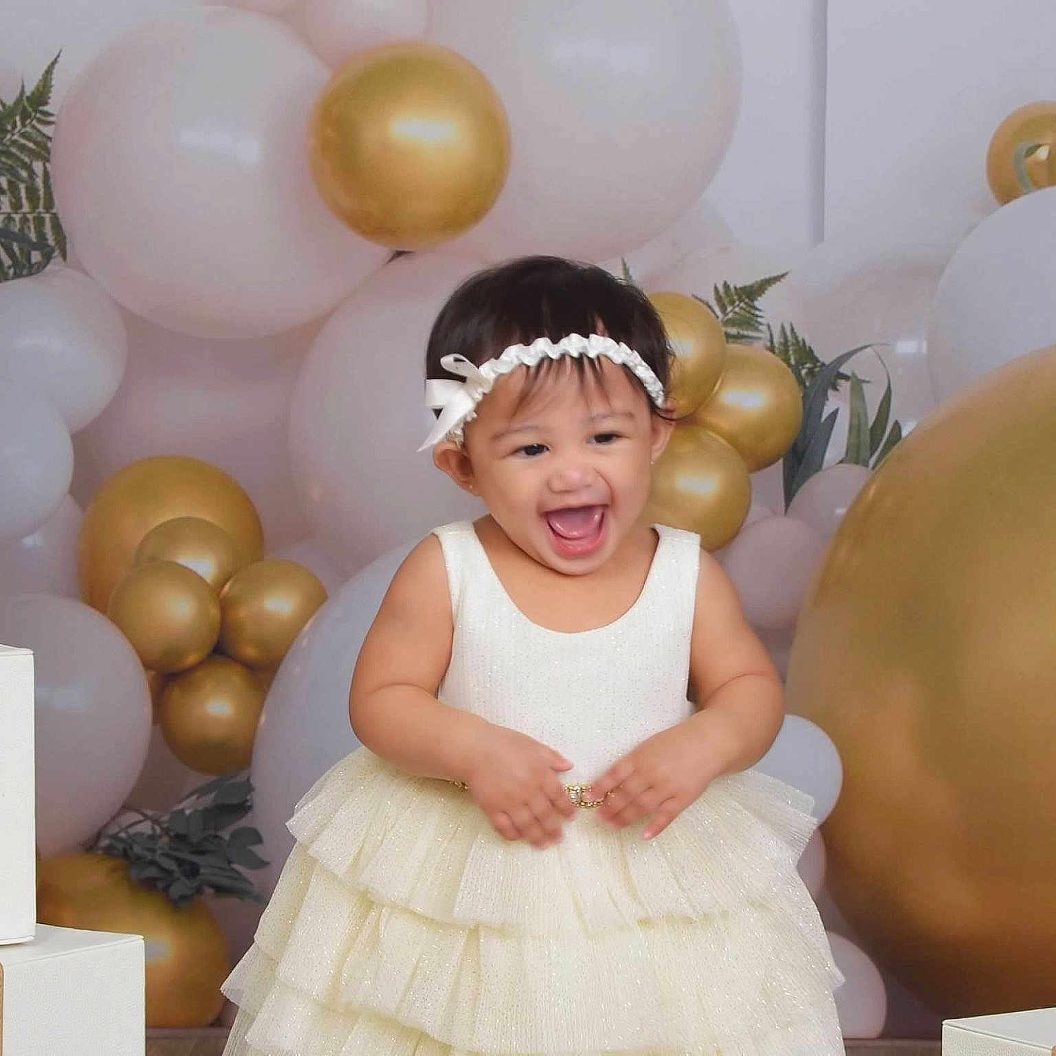 Kryzella Rosé is registered to the contest to win money with this photo: toddler, child, dress, headband, balloons, gold, white, gift, present, celebration, party, smile, happy, indoors, cute, young, festive, decorations, fun, joy