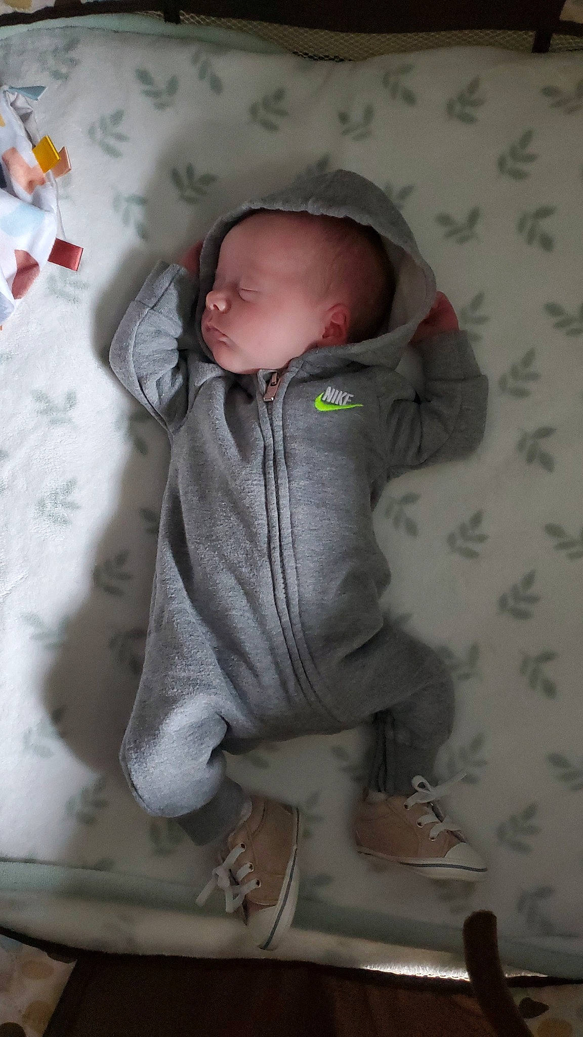 Oliver is registered to the contest to win money with this photo: baby, baby_products, baby_sleeping, baby_toddler_clothing, cheek, child, comfort, grey, hood, hoodie, linens, pattern, person, room, sitting, skin, sleeve, textile, toddler
