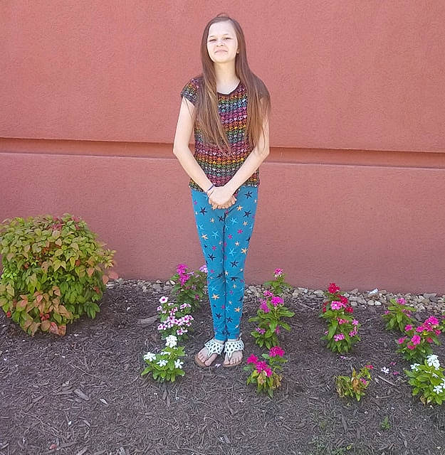 Brittany joined the competition — help win amazing prizes! art, denim, floral_design, flower, fun, grass, jeans, leg, person, plant, shoe, trousers, wildflower