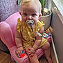 Scarlet is registered to the contest to win money with this photo: baby, pacifier, child, yellow_clothing, pink_chair, toy, plant, indoor, wood_floor, window, curious, sitting, cute, polka_dot, infant, small_hand, small_foot, face, blond_hair, home