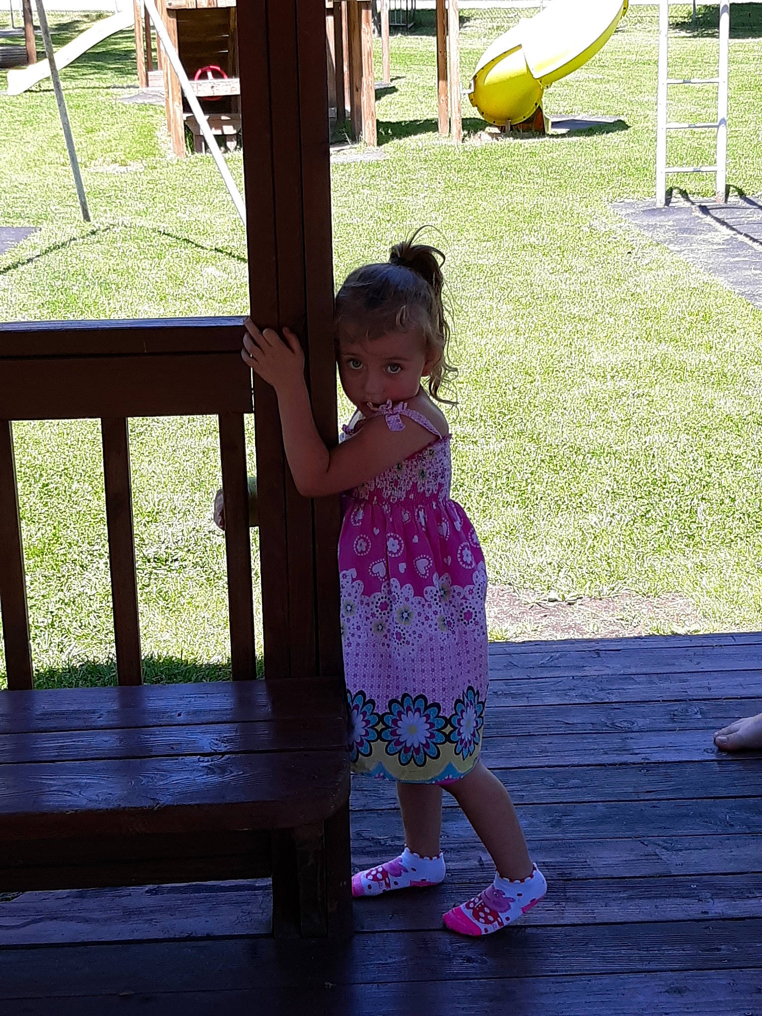 Maia is registered to the contest to win money with this photo: backyard, child, city, fun, grass, happy, human_settlement, leisure, outdoor_play_equipment, park, person, play, playground, public_space, recreation, smile, standing, summer, toddler, tree