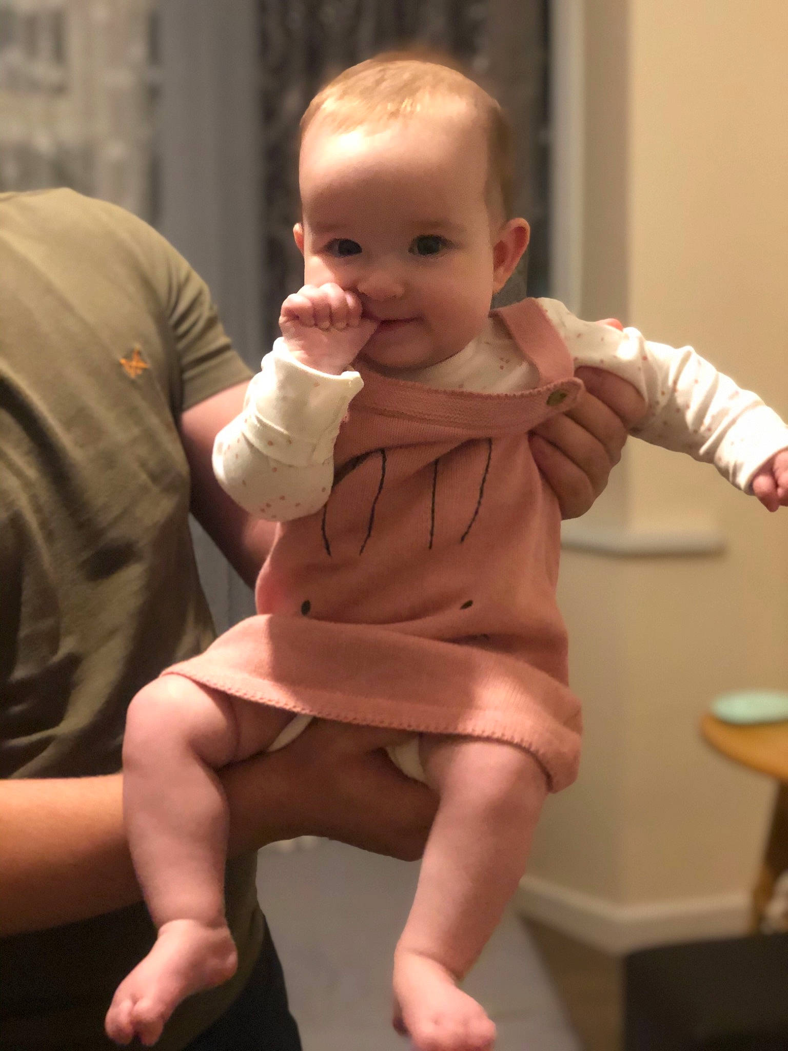 Lia is registered to the contest to win money with this photo: baby_toddler_clothing, cheek, face, finger, gesture, hand, human_body, joint, joy, knee, leg, lip, mouth, muscle, person, shoulder, skin, sleeve, smile, standing