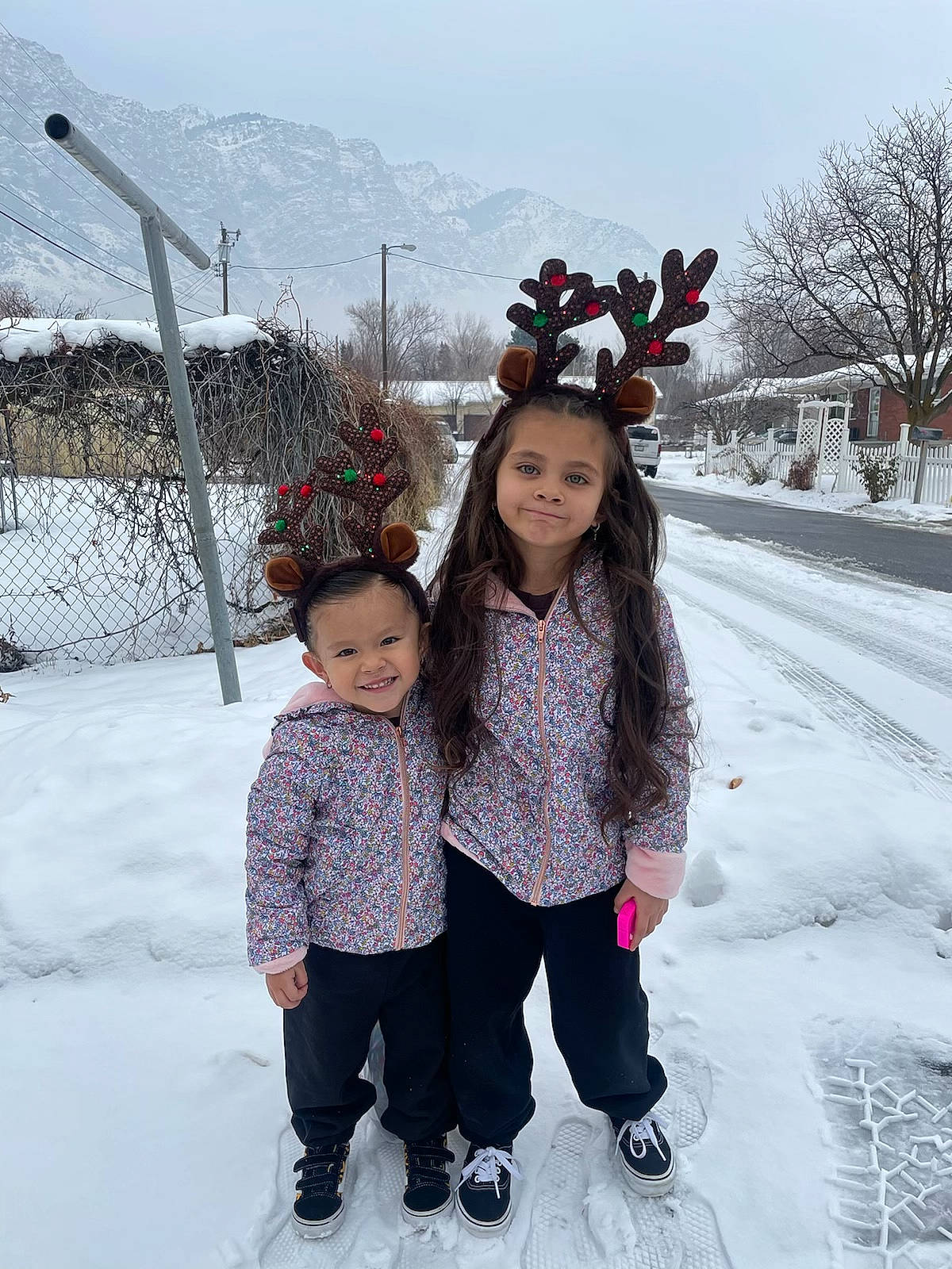 Melanie is registered to the contest to win money with this photo: beauty, event, fence, freezing, fun, happy, head, human_body, joy, leisure, mammal, people, person, plant, recreation, sky, smile, snow, toddler, tree