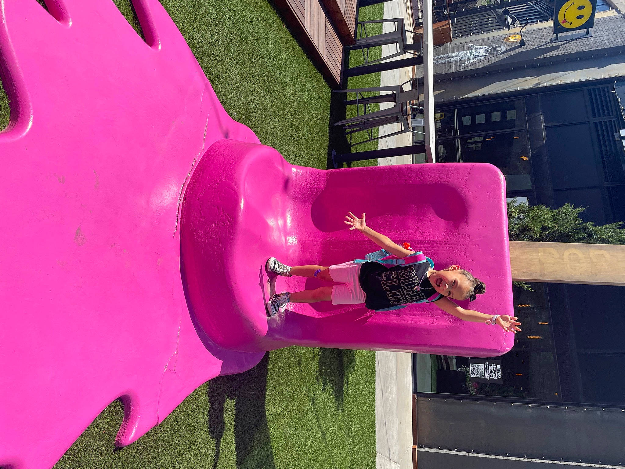 Melanie is registered to the contest to win money with this photo: art, automotive_wheel_system, bumper, carmine, fun, leisure, magenta, person, pink, plant, purple, sculpture, tints_and_shades, tree, violet, visual_arts, water, wheel