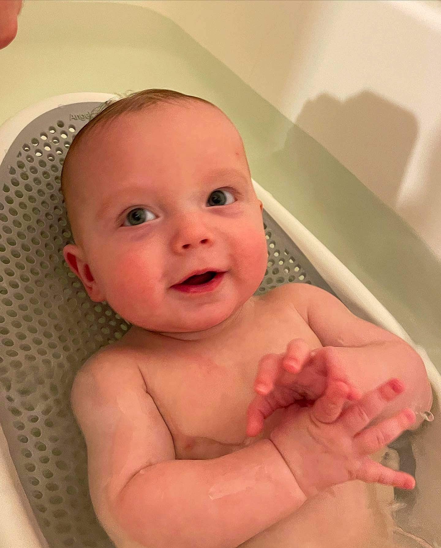 Bradley is registered to the contest to win money with this photo: baby, baby_bathing, bathing, bathroom, bathtub, cheek, chin, eye, eyebrow, face, fluid, iris, lip, mouth, nose, person, pink, skin, smile, stomach
