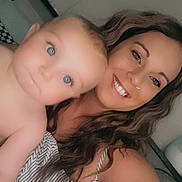 Owen joined the competition — help win amazing prizes! woman, baby, selfie, smile, indoor, person, child, face, happy, curly_hair, striped_clothing, skin, head, eyes, shoulder, portrait, closeup, family, love, casual