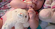 Eleanor is registered to the contest to win money with this photo: baby, blanket, bottle, child, cozy, cuddly, cute, easter, fabric, face, hand, heart_pattern, indoor, infant, pink, plush_toy, resting, sleepwear, soft_toy, stuffed_animal