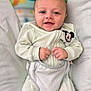 Jackson is registered to the contest to win money with this photo: baby, smiling, infant, onesie, mickey_mouse, seat, cushion, child, cute, happy, portrait, clothing, indoors, toy, comfort, young, person, face, skin, hands