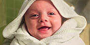 Jackson is registered to the contest to win money with this photo: baby, smiling, towel, hooded_towel, face, closeup, happy, child, infant, wrapped, bathroom, soft, cute, portrait, skin, eyes, mouth, young, expression, indoors