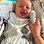 Jackson joined the competition — help win amazing prizes! baby, infant, smiling, tongue_out, striped_clothing, hand, blanket, cartoon_crocodile, playful_background, indoor, cute, child, person, happy, closeup, sitting, fabric, soft_lighting, nursery, care