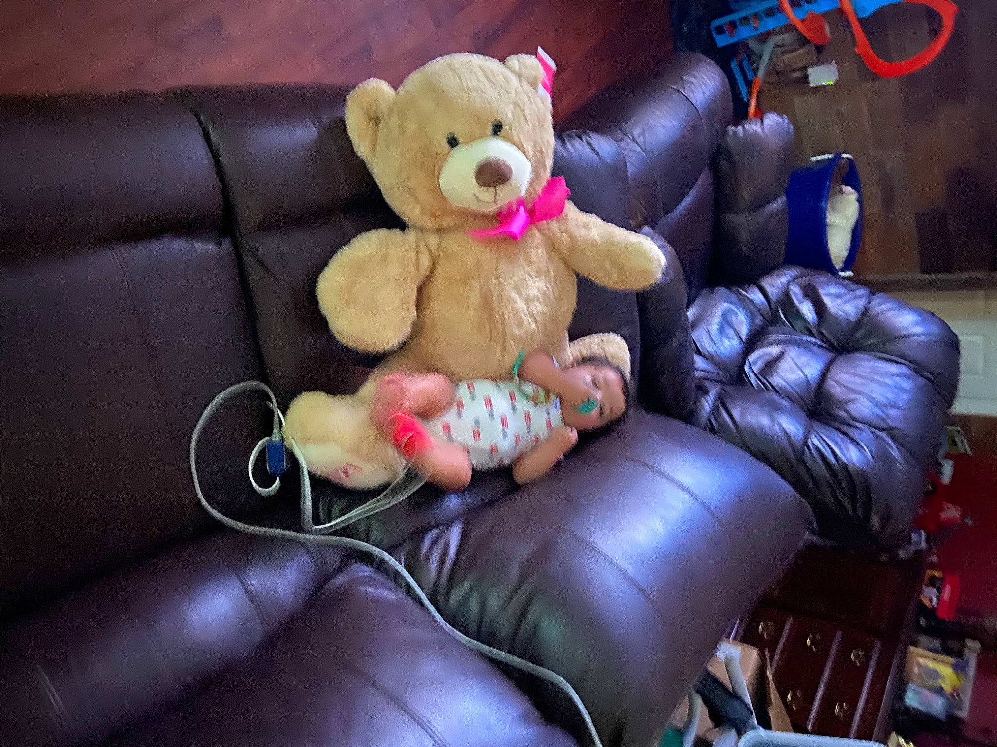 Corbyn is registered to the contest to win money with this photo: animation, armrest, baby_toys, car_seat, carmine, chair, comfort, couch, fictional_character, fun, light, magenta, organ, pc_game, person, plush, room, sitting, stuffed_toy, teddy_bear