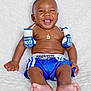 Dyce joined the competition — help win amazing prizes! baby, infant, smiling, boxing_gloves, blue_shorts, gold_necklace, cute, happy, sitting, barefoot, portrait, child, young, studio_shot, white_background, playful, funny, chubby, expression, clothing