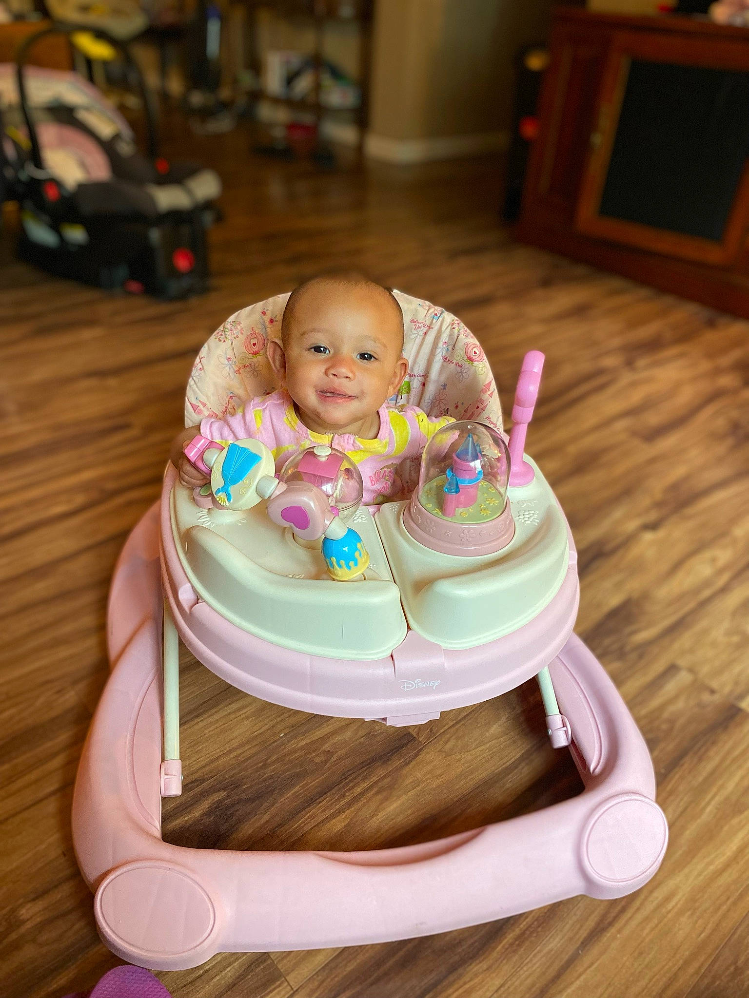 Kassidy is registered to the contest to win money with this photo: baby, baby_products, baby_toddler_clothing, baby_toys, chair, comfort, flooring, fun, happy, hardwood, joy, leisure, magenta, person, room, sitting, skin, sweetness, table, tableware