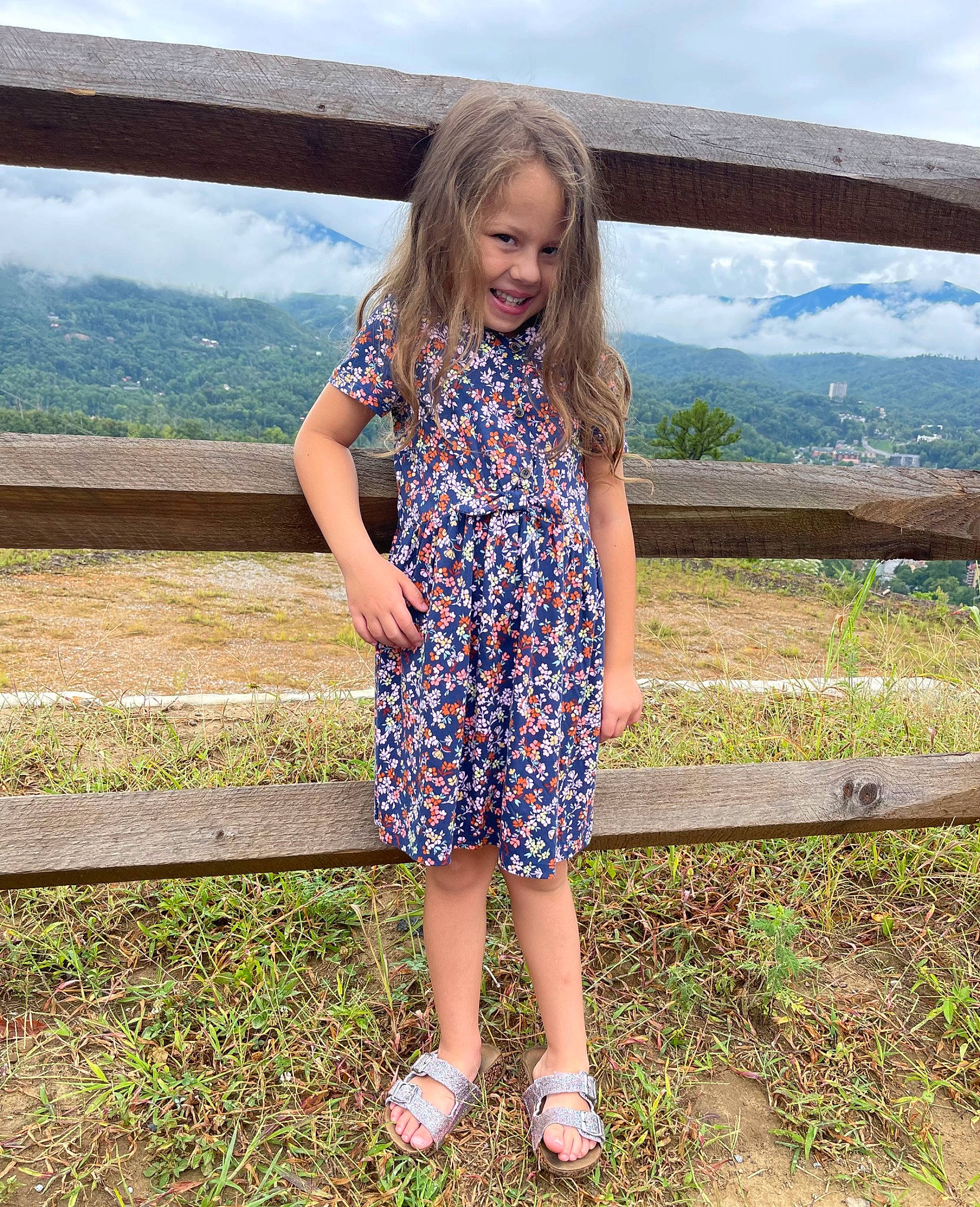 Josilyn is registered to the contest to win money with this photo: blond, brown_hair, cloud, day_dress, electric_blue, grass, grassland, hair, happy, human_leg, joy, landscape, leg, leisure, pattern, people_in_nature, person, sandal, sky, travel