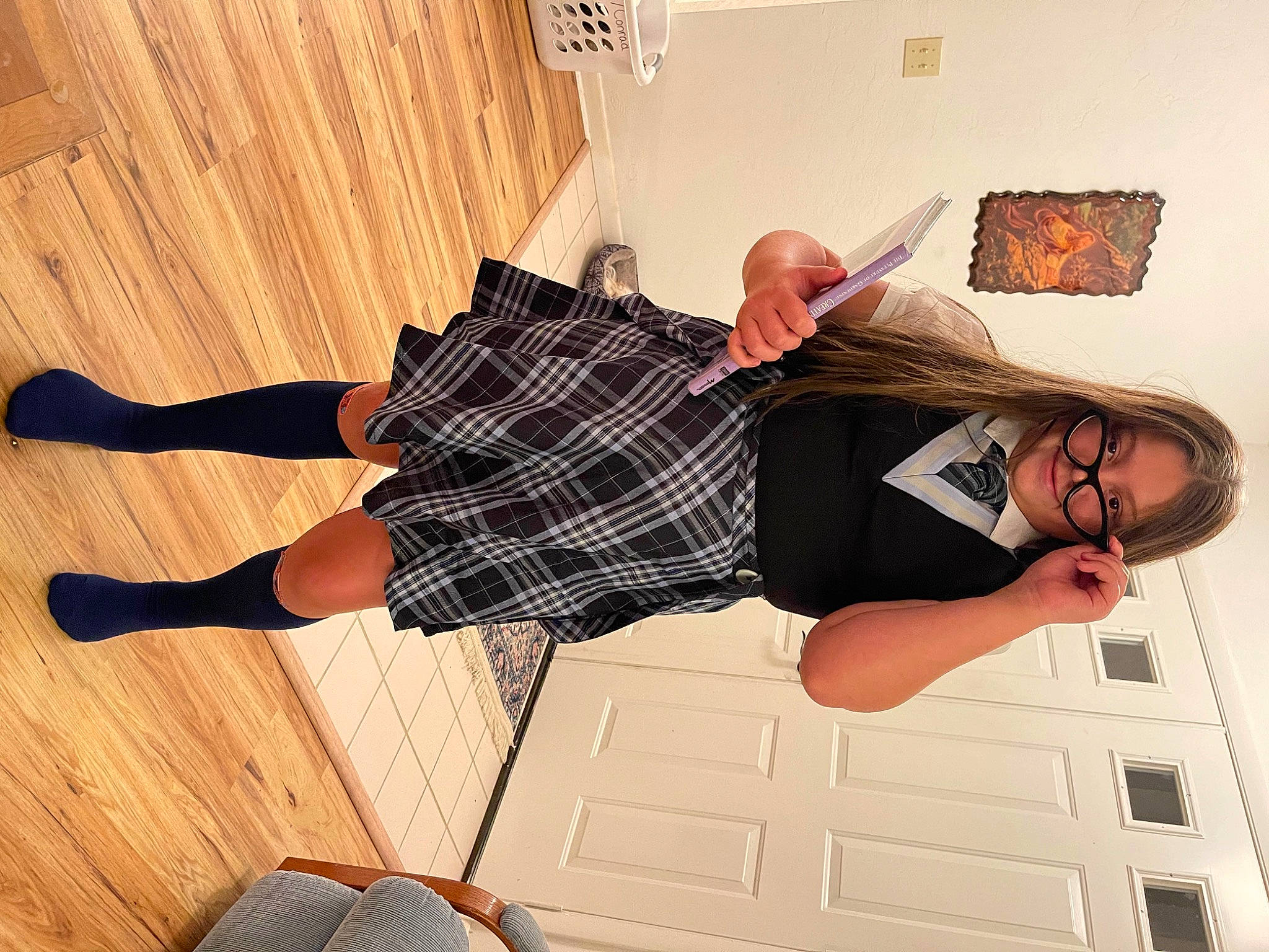 Sophia is registered to the contest to win money with this photo: comfort, cool, elbow, eyewear, flooring, happy, hardwood, human_leg, joy, knee, leg, pattern, person, plaid, sleeve, smile, sock, tartan, thigh, waist