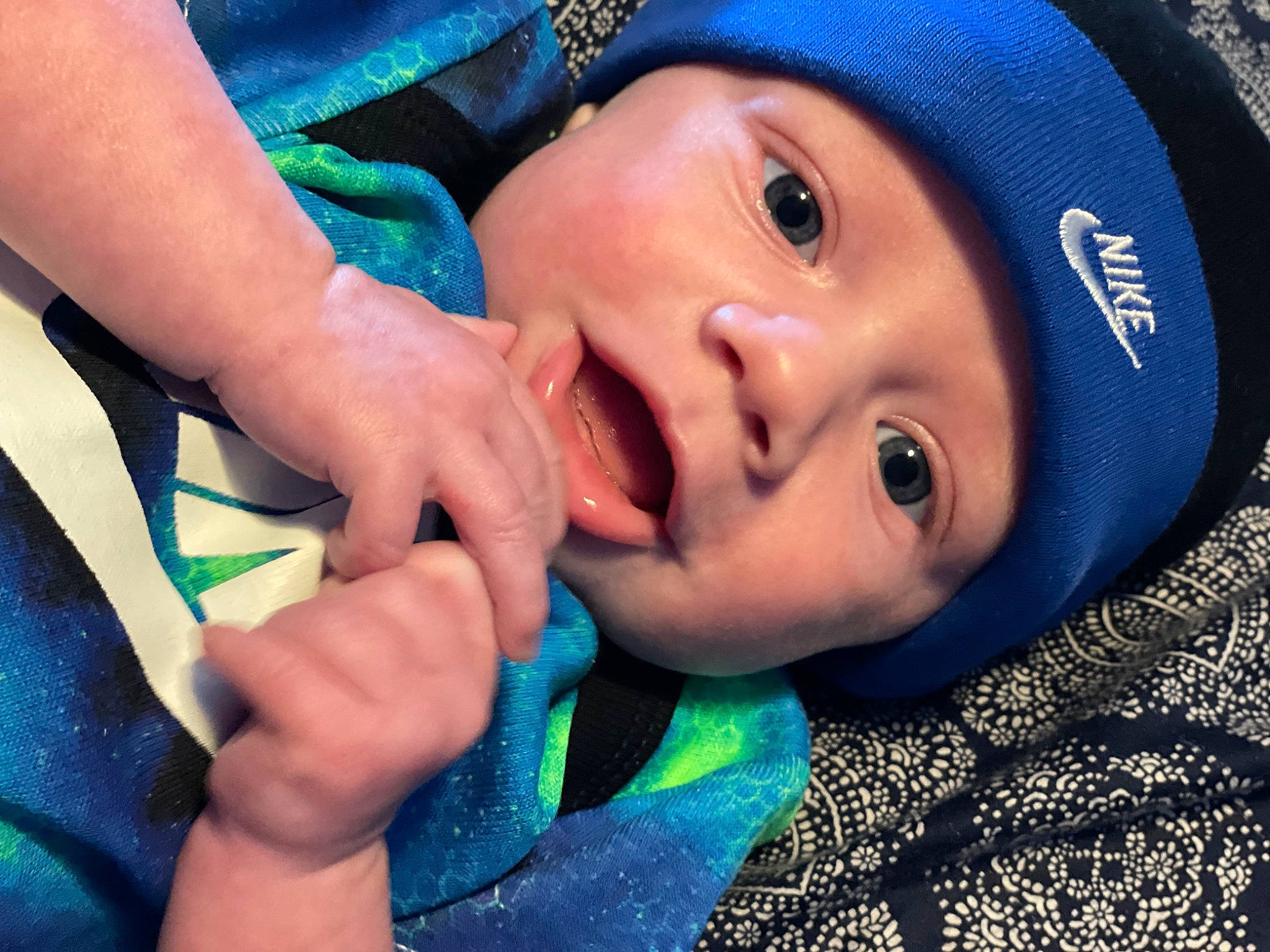 Drennon is registered to the contest to win money with this photo: azure, baby, blue, cap, cheek, chin, eye, eyebrow, eyelash, face, finger, gesture, happy, headgear, headwear, iris, lip, mouth, nose, person
