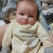 Lucas joined the competition — help win amazing prizes! baby, infant, onesie, mittens, blanket, bed, person, face, cheeks, sleepwear, soft, indoors, cute, newborn, clothing, portrait, resting, young_child, holding, comfort