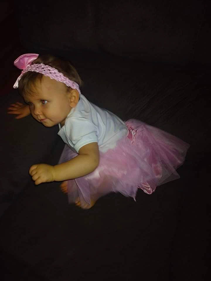Jaylee is registered to the contest to win money with this photo: baby, baby_toddler_clothing, bridal_accessory, dress, embellishment, event, eye, fashion_accessory, flash_photography, fun, hair, hair_accessory, happy, headband, headpiece, jewellery, magenta, person, petal, sleeve