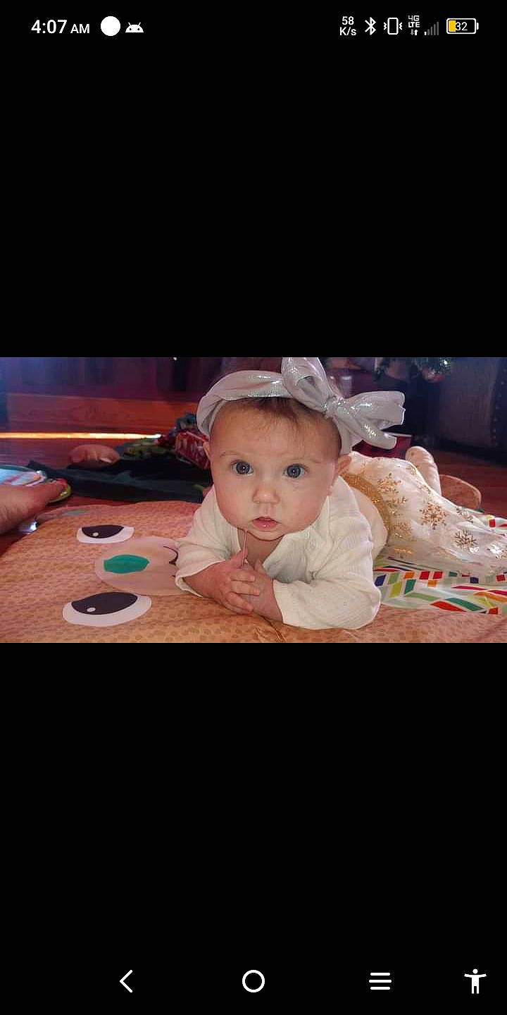 Jaylee is registered to the contest to win money with this photo: baby, baby_toddler_clothing, cheek, child, comfort, fashion_accessory, flash_photography, flooring, fun, happy, linens, person, portrait_photography, room, sitting, sleeve, surprise, tableware, toddler, wood