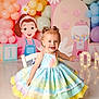 toddler, child, dress, birthday, balloons, colorful, pastel, smiling, happy, party, decorations, one_year_old, cute, indoor, celebration, barefoot, girl, toy_blocks, gumball_machine, photo_shoot