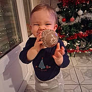 Rafaël participe au concours pour gagner de l'argent avec cette photo : toddler, child, christmas_tree, ornament, holiday, smiling, indoor, decorations, festive, happy, person, floor_tiles, window, long_sleeve_shirt, pants, celebration, seasonal, home, cute, joyful