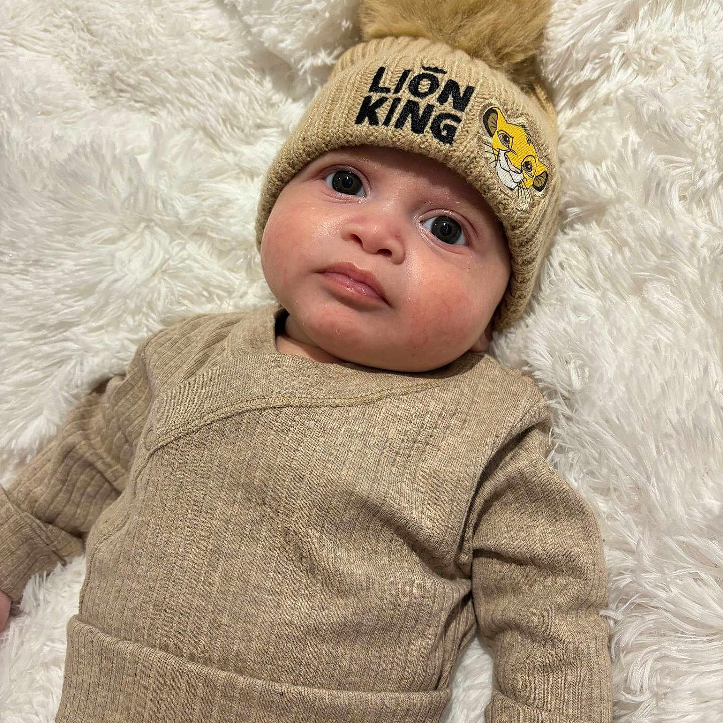 Arlo joined the competition — help win amazing prizes! baby, beanie, bonnet, cap, clothing, coat, face, glove, happy, hat, head, hood, knitwear, newborn, pants, person, photography, portrait, smile, sweater