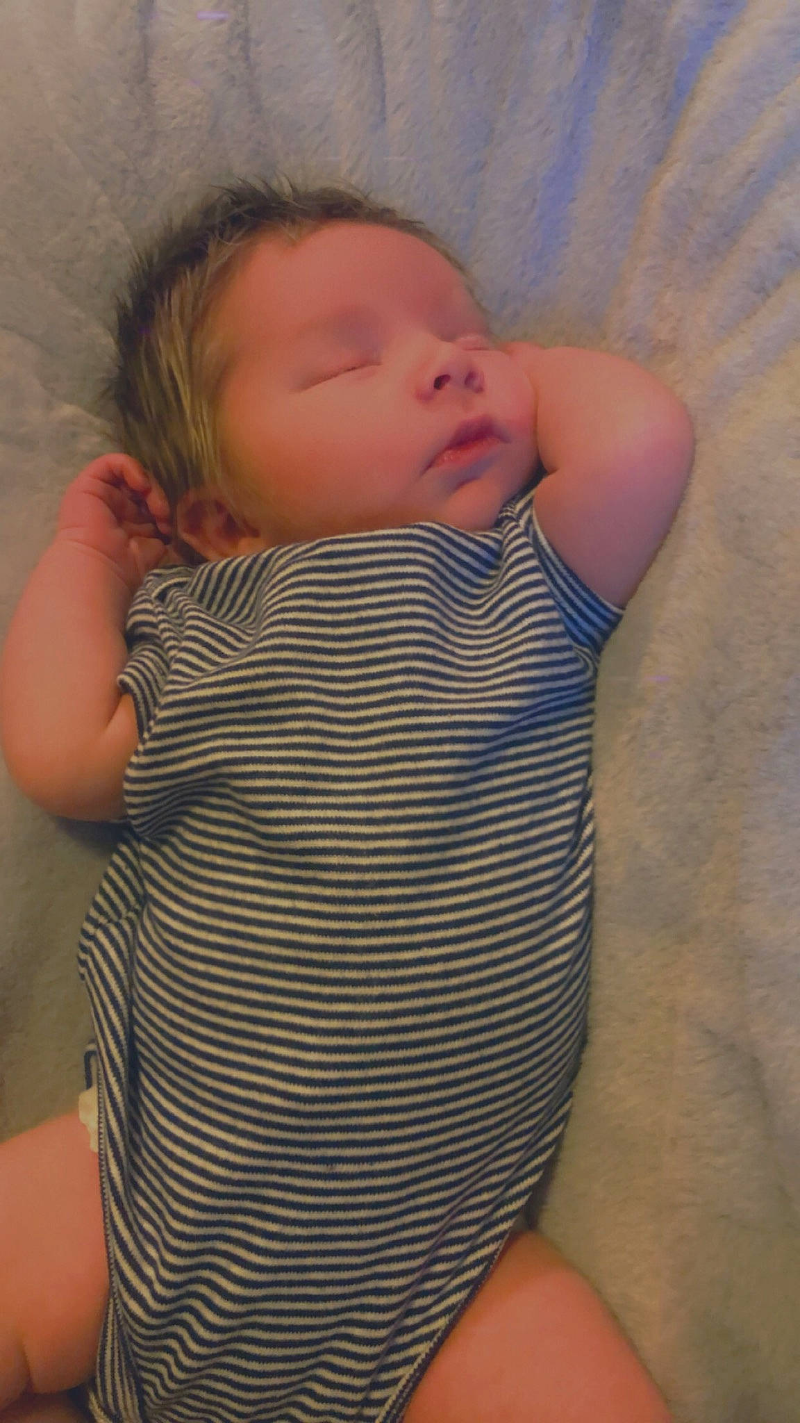 Arlo is registered to the contest to win money with this photo: arm, baby, baby_toddler_clothing, cheek, chin, comfort, eye, eyebrow, finger, gesture, human_body, iris, joint, lip, mouth, neck, nose, person, skin, sleeve