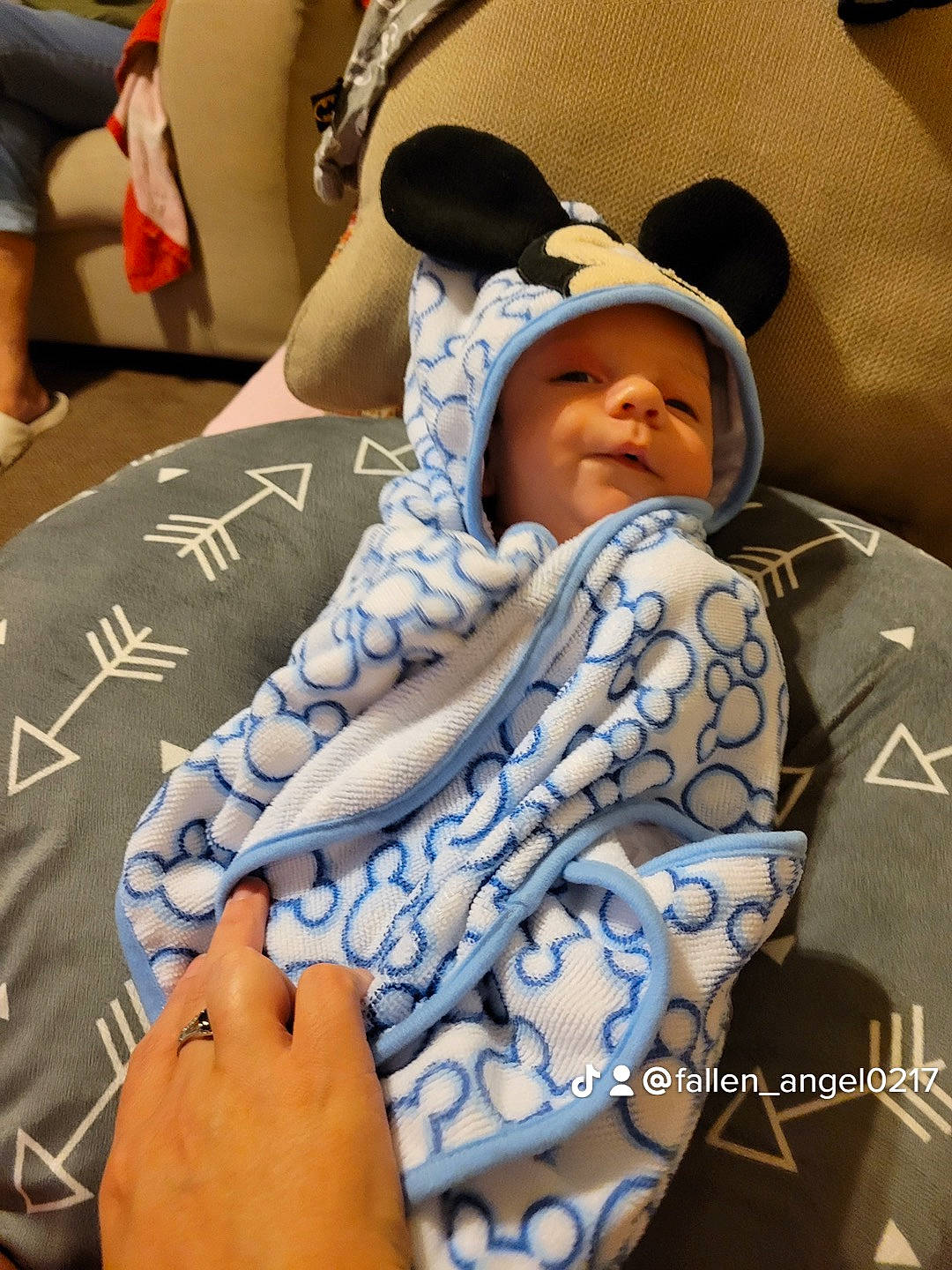 Gage is registered to the contest to win money with this photo: baby, baby_products, cap, car_seat, child, comfort, event, finger, fun, hat, headwear, human_leg, knee, leisure, mouth, nail, pattern, person, room, sitting