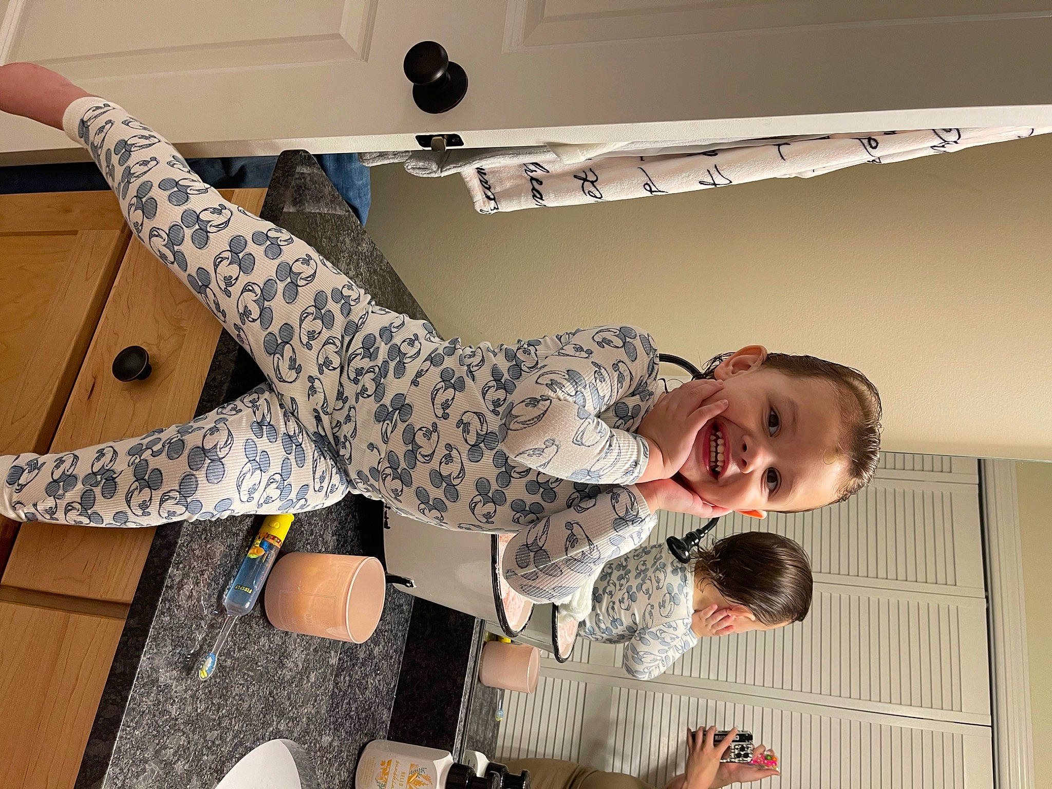 Lenny is registered to the contest to win money with this photo: camouflage, elbow, finger, fun, gesture, happy, human_leg, joint, joy, knee, military_camouflage, pattern, person, sleeve, smile, standing, t_shirt, thigh, thumb, toddler
