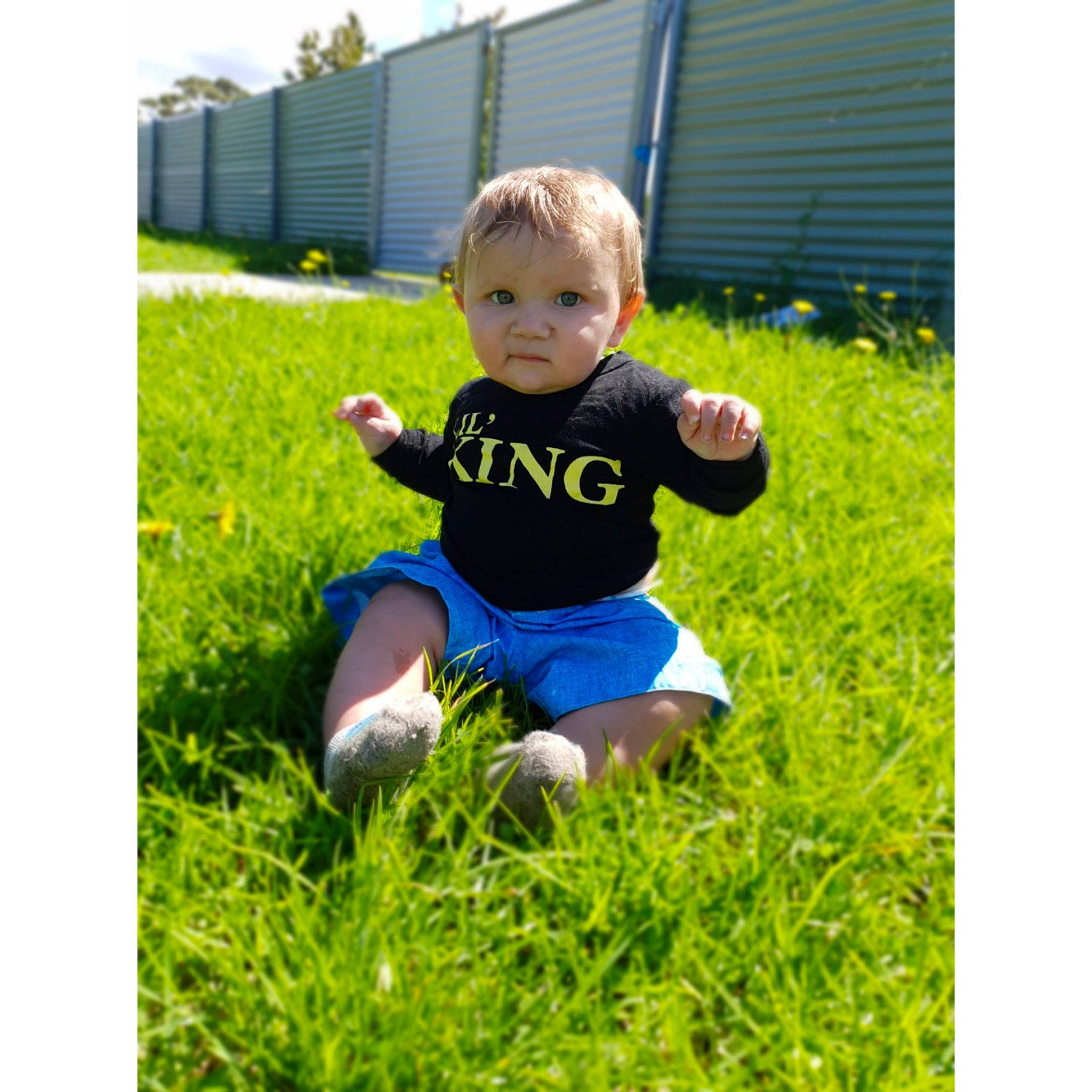 Tyrese joined the competition — help win amazing prizes! baby, ball, child, fun, grass, happy, lawn, person, plant, play, sitting, soccer_ball, summer, t_shirt, toddler, yard