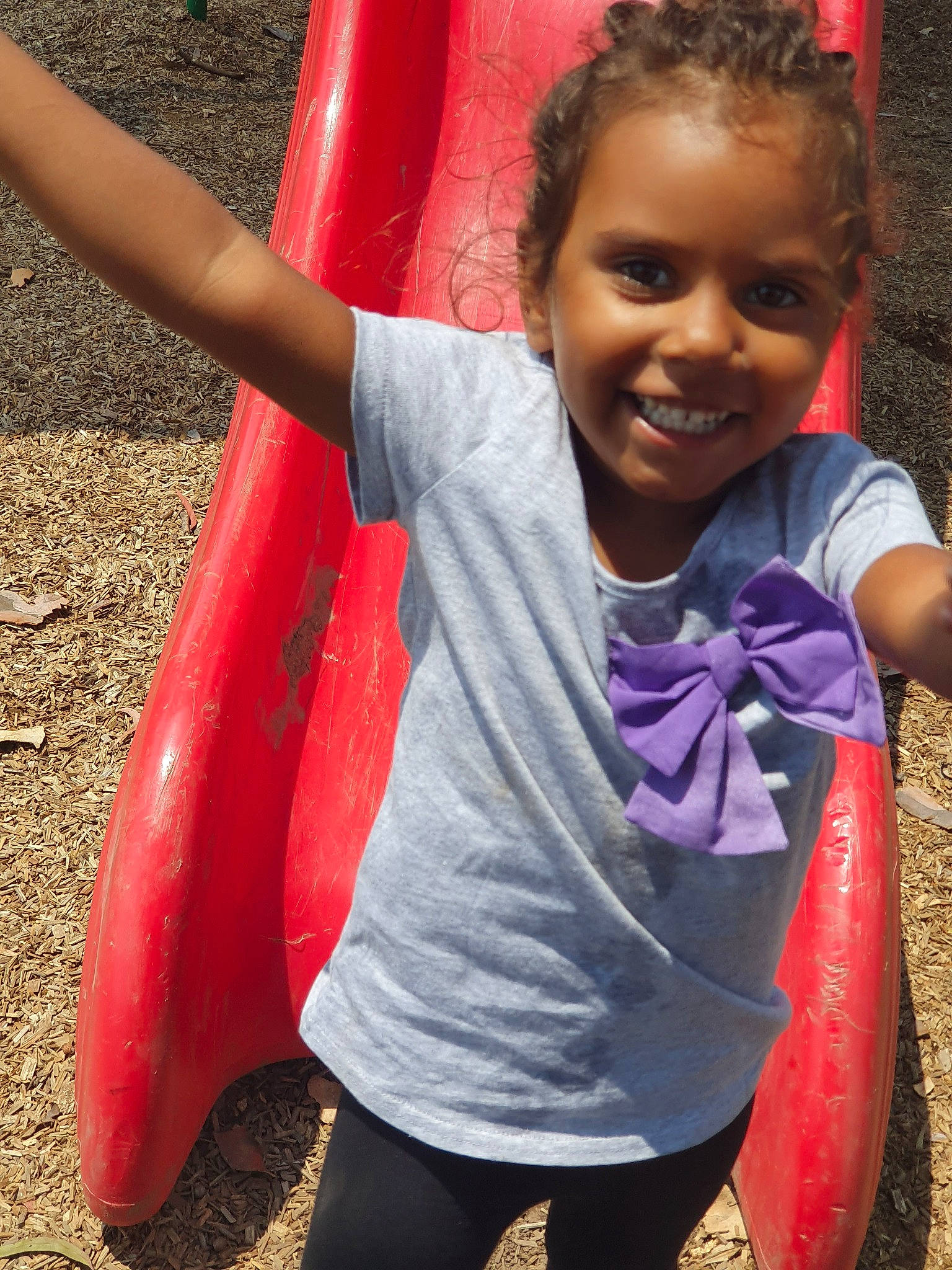 Tashari is registered to the contest to win money with this photo: child, fun, joy, magenta, outdoor_play_equipment, person, pink, play, playground, smile