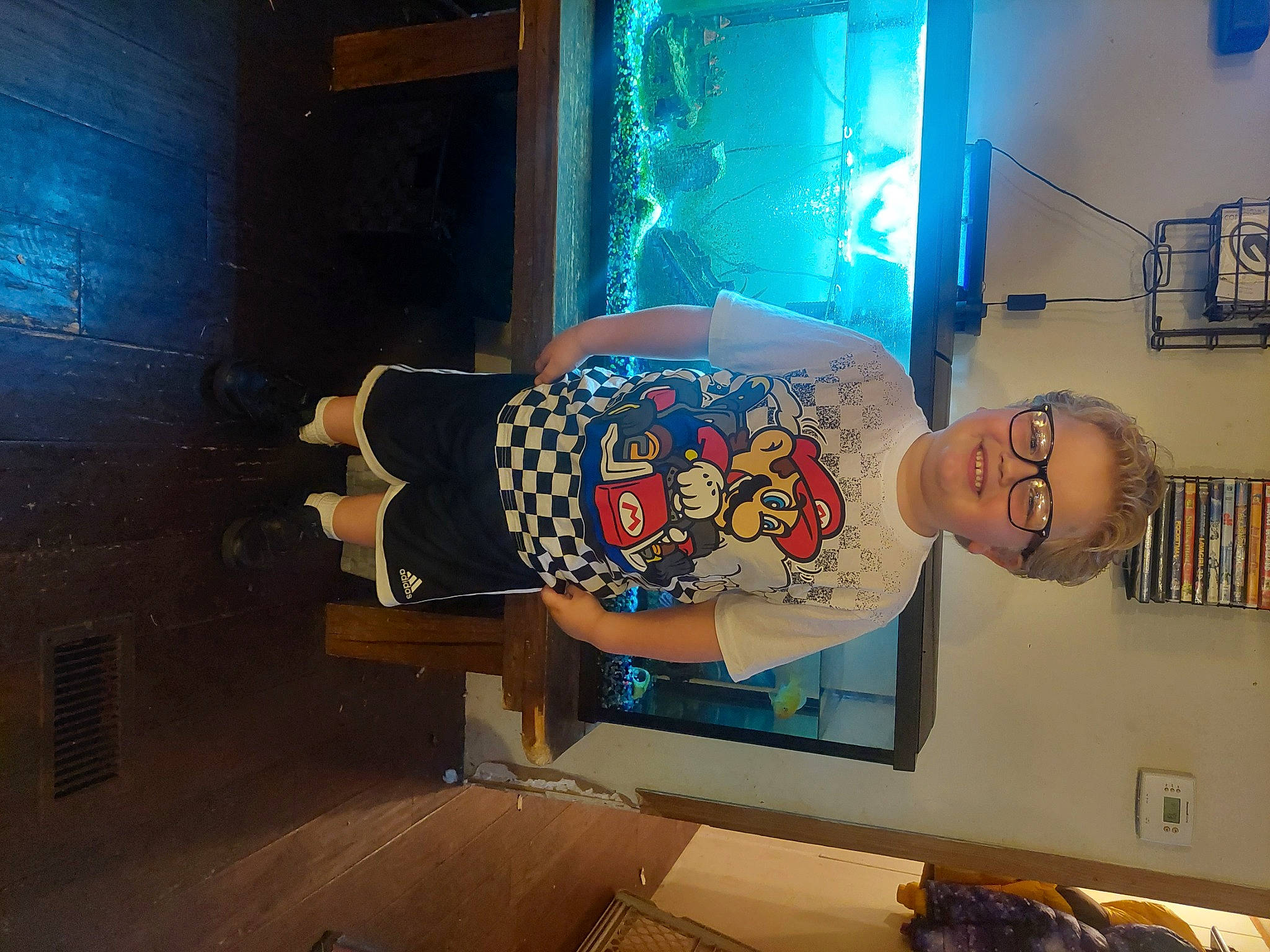 Jack is registered to the contest to win money with this photo: advertising, art, artist, display_device, event, fun, joy, machine, media, mural, painting, person, room, smile, space, t_shirt, television_set, visual_arts, world