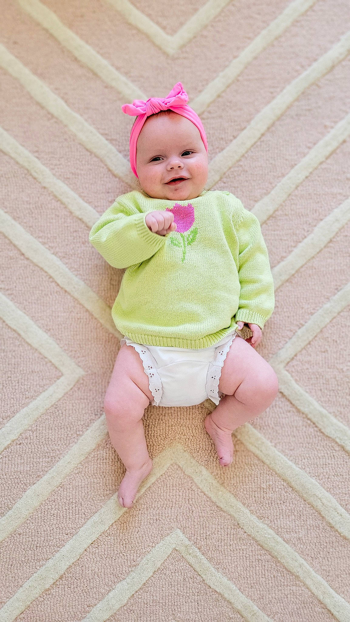 Vivian joined the competition — help win amazing prizes! baby, baby_products, baby_toddler_clothing, cap, cheek, dress, face, fashion_accessory, floor, flooring, foot, headgear, headwear, joy, linens, outerwear, pattern, person, pink, skin